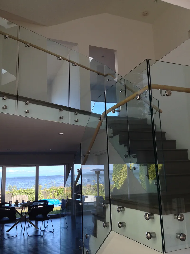 Interior glass stair railing in Vancouver residence